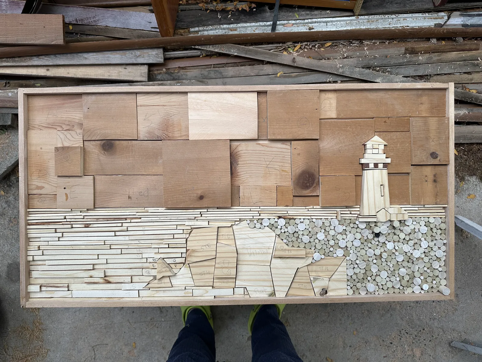 The lighthouse relief assembled in raw wood