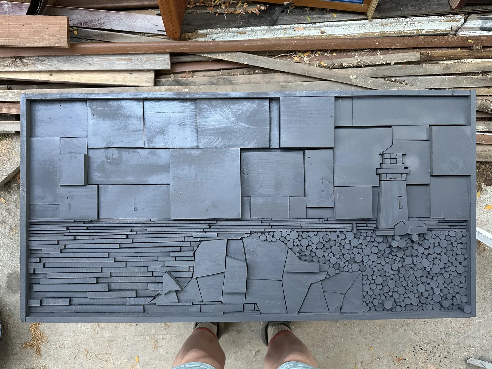 The lighthouse relief after a coat of gray primer